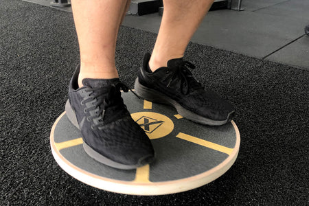 7 Surprising Exercises You Can Do With A Balance Board That Will Sculpt Your Body