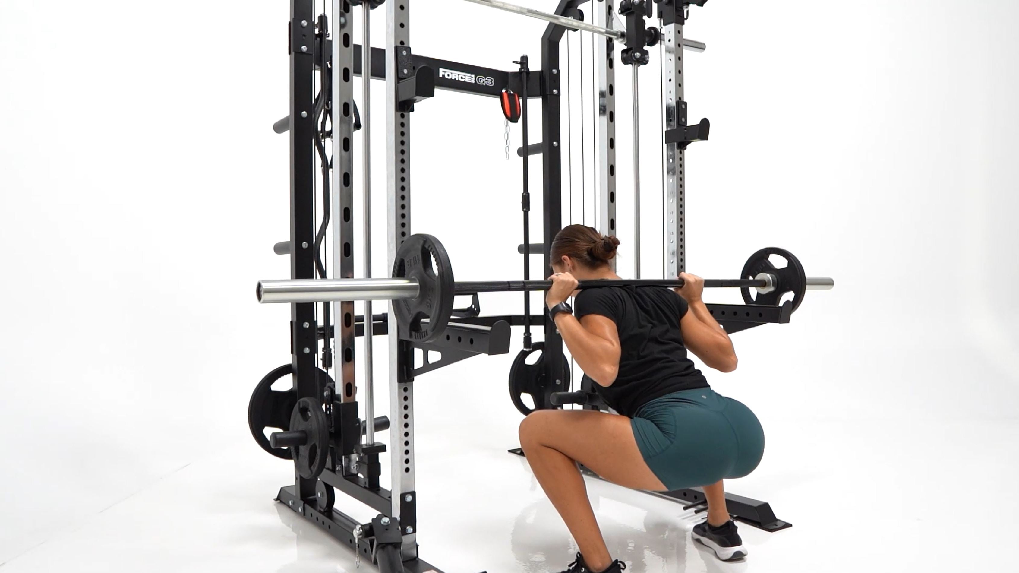 Girl doing squat with a barbell