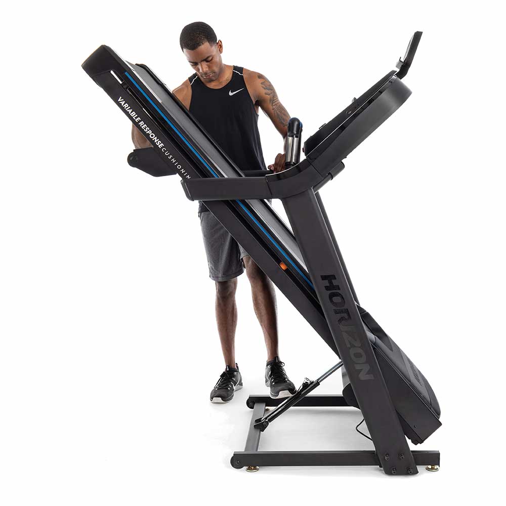 Horizon 7.0AT Treadmill folded by man