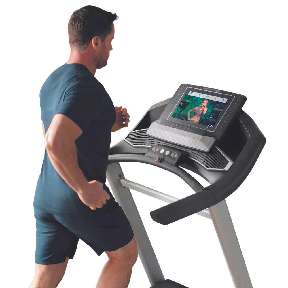 Proform Trainer 14 Treadmill side view of console with man in use