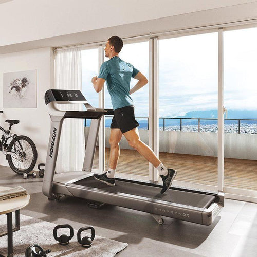 Load image into Gallery viewer, horizon paragon x treadmill side view with man
